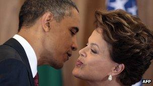 US President Barack Obama and Brazilian President Dilma Rousseff greet each other during a joint press conference in Brasilia on 19 March 2011
