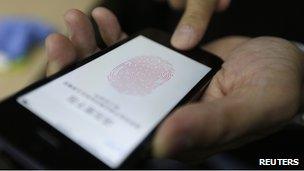 Journalist testing Touch ID unlock function