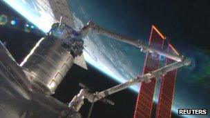 Cygnus cargo ship docking with International Space Station