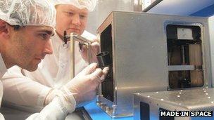 Made in Space scientists work on the 3D printer prototype