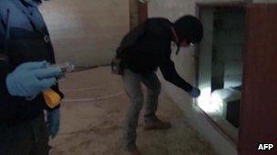 OPCW inspectors at a site in Syria in an image taken from Syrian television on 10 October 2013