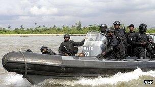 Nigerian navy special forces patrol against pirates.