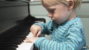 Young boy playing the piano