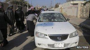 Bullet-ridden car outside the home of Iraqi Sunni MP Ahmed al-Alwani, Ramadi (28 December)