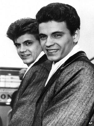Phil, left, and Don of the Everly Brothers arrive at London Airport from New York to begin their European tour on 1 April 1960 file photo