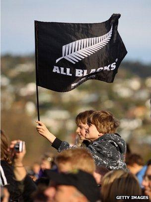 An All Black supporter waves a flag during a New Zealand All Blacks IRB Rugby World Cup 2011 fan day on 18 September 2011 in Christchurch, New Zealand
