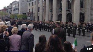 President Higgins inspects the guard of honour at the GPO