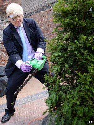 Boris Johnson trimming a tree