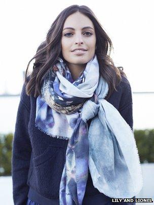 A model wearing a Lily and Lionel scarf