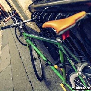 bicycle locked to railings, London