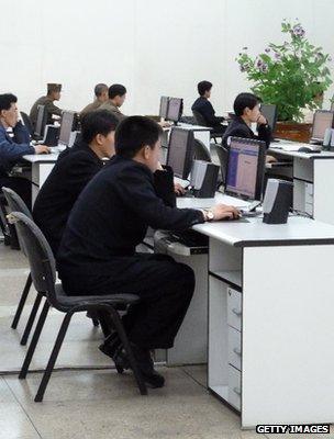 North Koreans at computers