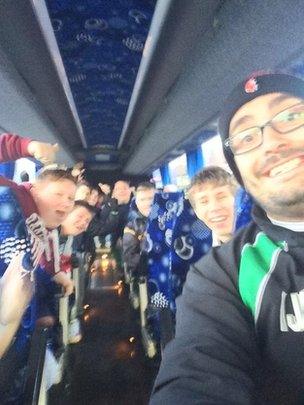 Iain and the team on the bus