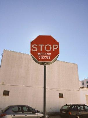 Stop sign with "McCann Circus" written under stop.