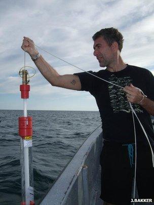 Prof Stefano Mariani collecting a sample of seawater (Image: Judith Bakker)