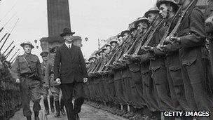 First Taoiseach of the Republic of Ireland Eamon de Valera inspects a guard of honour at O'Connell Street in Dublin