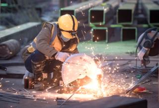 A laborer works at the construction site of Huoshenshan Hospital