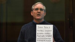 Paul Whelan, a former US marine accused of espionage and arrested in Russia in December 2018, stands inside a defendants" cage as he waits to hear his verdict in Moscow on June 15, 2020