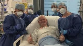 Brian Harvey with the medics who treated him during nine weeks in hospital