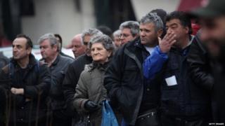Members of the public queue to receive free food opposite Athens' Central Market in the Omonia district (February 2012)