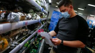 Man wearing a mask in a shop