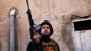 A member of the Iraqi special forces Counter Terrorism Service (CTS) holds a position in Mosul's al-Jazair neighbourhood on January 17, 2017,