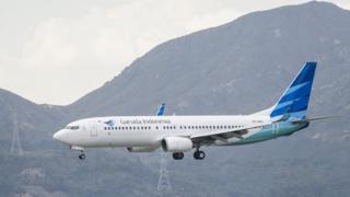 A Boeing 737-8U3 passenger plane belonging to the Garuda Indonesia lands at Hong Kong International Airport in 2018