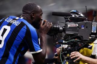 Inter Milan's Belgian player Romelu Lukaku kisses the lens of a live television camera