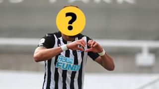 A Newcastle player with a question mark hiding his face