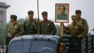 Some-Chinese-Red-Guards-holding-a-portrait-of-Mao