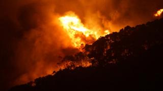 A bushfire bears down on Wye River on Christmas Day