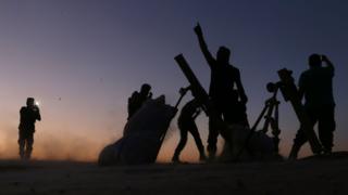 Fighters from the Free Syrian Army cheer and react as they fight against the Islamic State (IS) group jihadists on the outskirts of the northern Syrian town of Dabiq, on October 15, 2016.