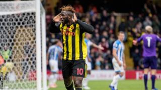 Issac Success celebrates scoring against Huddersfield