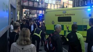 Rescue workers gather for di area.