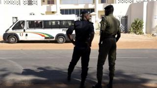 Police officers stand in front of the court where the verdict was handed down