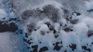 Melting ice after rain in Greenland