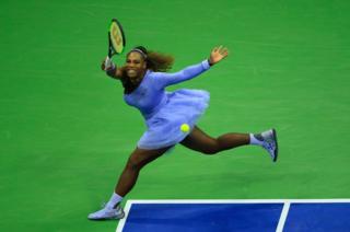 Serena Williams returns the ball during her women's singles second-round match at the US Open in New York