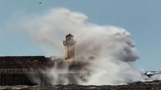 Waves breaking on the sea front in Ardrossan, Ayrshire