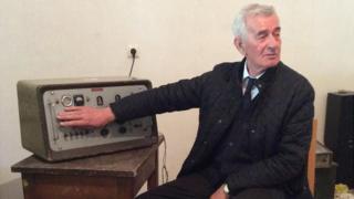 Nesti Vako with old Sigurimi surveillance equipment