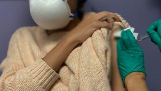 Girl getting vaccine