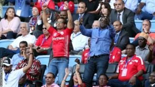 Simba's part owner Mohammed Dewji celebrates with fans at a game