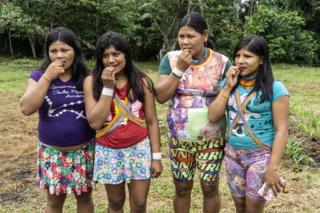 Four women try the chocolate