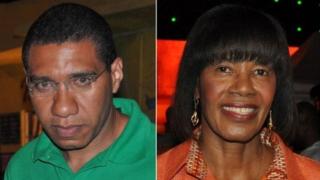 A file photo from 28 December 2011 shows Andrew Holness (left) and Portia Simpson Miller