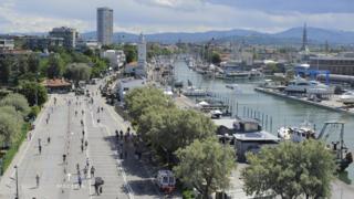 Participants run down past the harbour during the Challenge Family Triathlon Rimini on May 26, 2013 in Rimini, Italy.
