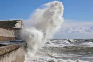 A wave crashing on a beach