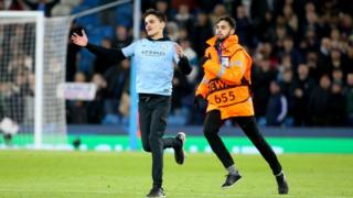 Pitch invader following the UEFA Champions League group A match between Manchester City and Paris Saint-Germain