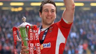 Ryan Jones celebrates Wales' 2012 Grand Slam win with the Six Nations trophy