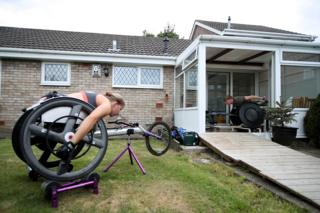 Two wheelchair athletes train outside their homes