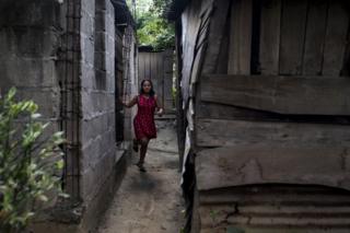 Nahín outside her home