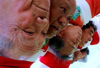 Members of Tokyo's Fuwaku Rugby Club train outdoors