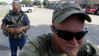 Terry Jackson, left, and Jonathan McCroskey, members of Operation Hero Guard, outside military recruiting station in Cleburne, Texas. 21 July 2015